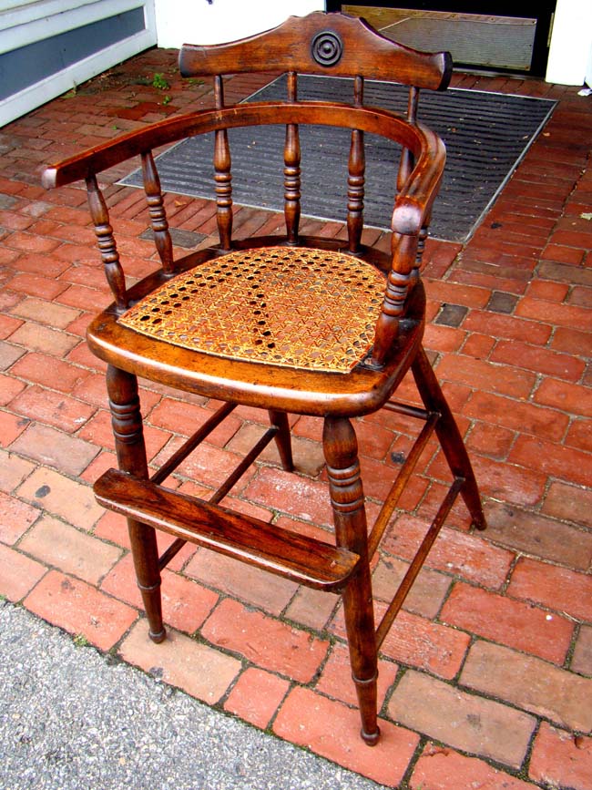 A charming19th century child's high chair with rattan seat circa 1860-1890